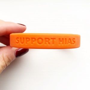 Orange rubber ‘Support HIAS’ Youth bracelet
